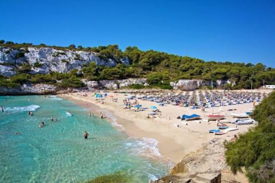 Beach cove with umbrellas and sunbeds